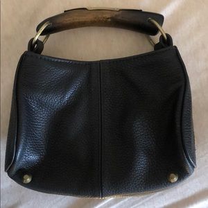 Mini leather purse . Wooden handle with gold